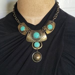 Tribal Egyptian inspired turquoise colored stones, antiqued gold colored chain.